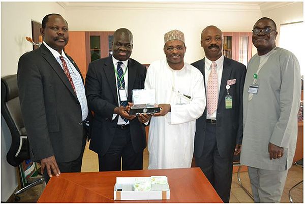 August 2014 file photo during the deliver of Nigeria’s first National ID Card by Epayplau shows Barr. Chris E. Onyemenam, DG/CEO NIMC (left); Mr. Bayo Adeokun, Electronic Payplus Limited; Engr. Aliyu A. Aziz, Director IT/ ID Database NIMC and Mr. Ben Alofoje, Assistant Director Research & Strategy NIMC. Photo credit: Epayplus