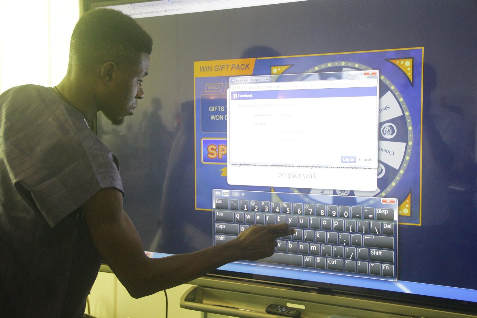 Participant playing an online game at Lagos Social week