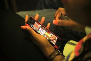 A mobile phone user seen at the 2016 Social Media Week Lagos
