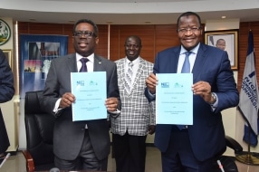 Lanre Gbajabiamila, Acting Director General, NLRC, om the left and Professor Umar Garba Danbatta, Executive Vice Chairman, NCC, after signing the MoU